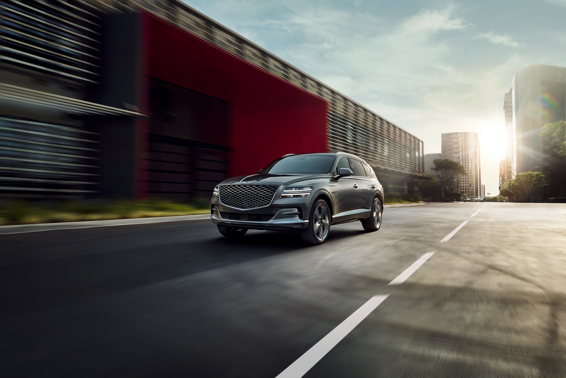 Genesis of York is a Car Dealership near Gettysburg PA | 2021 Genesis GV80 driving through the city