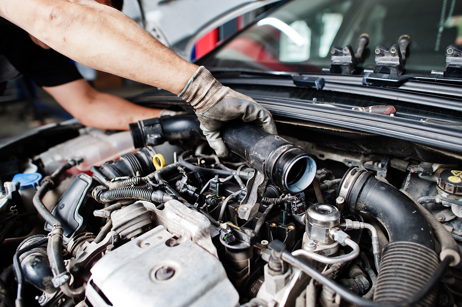 Genesis of York is a Car Dealership near Gettysburg PA | Mechanic working on a Genesis vehicle engine