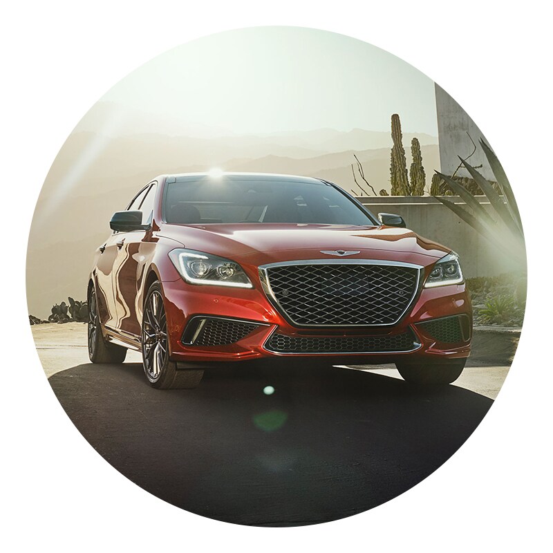 Genesis of York is a Car Dealership near Shrewsbury PA | Red Genesis G80 Driving Down Desert Road at Sunset