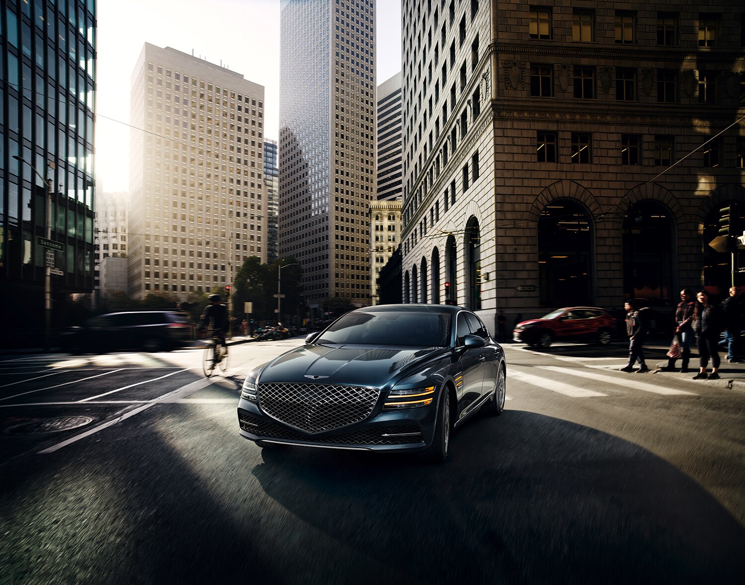 Genesis of York is a Jack Giambalvo Car Dealership in York, PA | 2021 Genesis G80 driving through city
