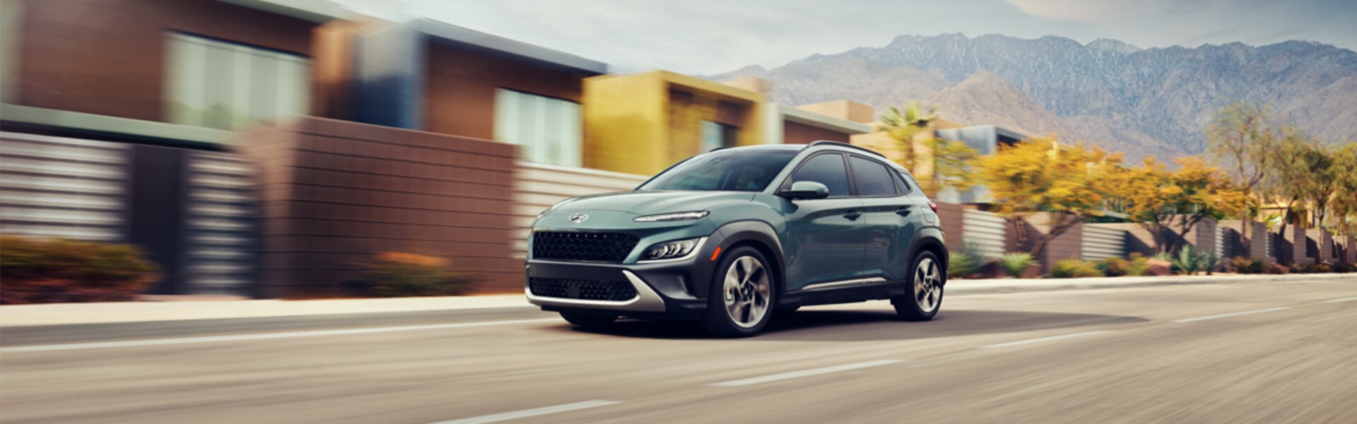 Performance features of the 2022 Kona N-Line at Jack Giambalvo Hyundai of York | 2022 Hyundai Kona N-Line Driving Through City Located in Desert