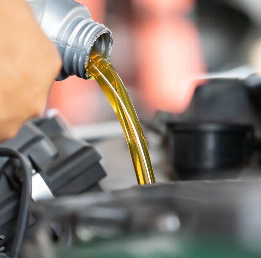 Extend the Life of Your Vehicle at Jack Giambalvo Hyundai in York, PA | New yellow engine oil is being poured into engine