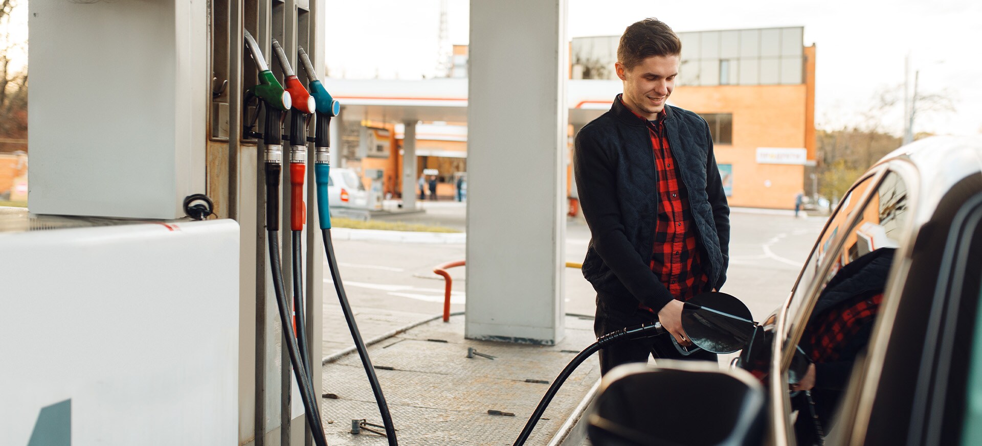 What Type of Gas is Best for My Car? At Jack Giambalvo Hyundai in York | Man Pumping Gas Into Car at Gas Station