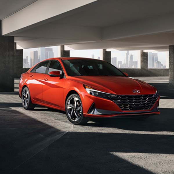 Model Features of the 2022 Hyundai Elantra at Jack Giambalvo Hyundai | Orange 2022 Hyundai Elantra Parked in Parking Garage