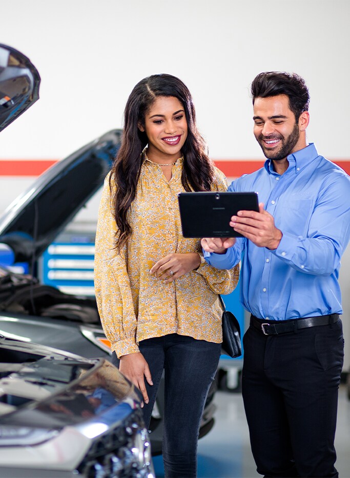 Best MPG At Jack Giambalvo Hyundai in York, PA | Service advisor talking to customer about maintenance for her car