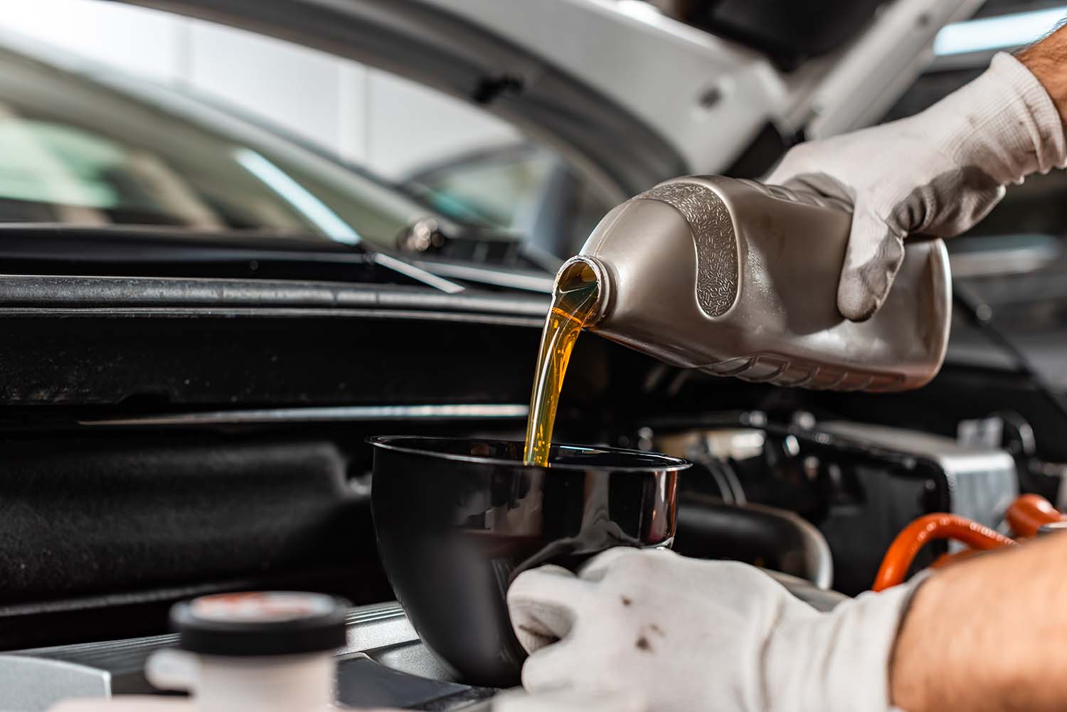 Difference between synthetic oil & conventional oil at Jack Giambalvo Hyundai | Mechanic refilling engine oil