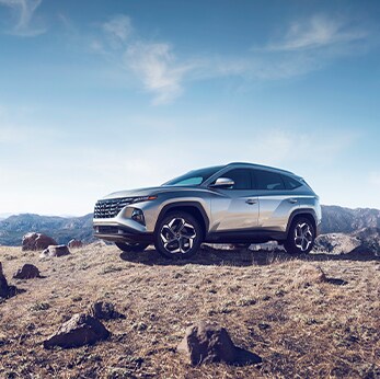 The 2022 Hyundai Tucson vs. The 2022 Hyundai Santa Fe at Jack Giambalvo Hyundai | Tucson parked ontop of rocky terrain