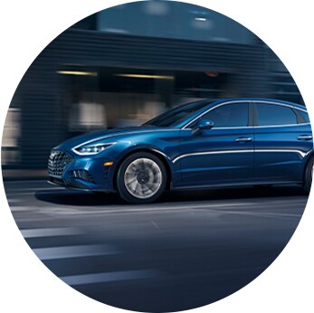 How to check your tires' health at Jack Giambalvo Hyundai | Blue Sonata drives fast on city streets during nightfall