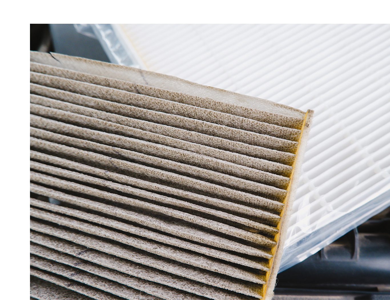 Cabin air filter replacement at Jack Giambalvo Hyundai | Comparision of dirty old cabin air filter with new cabin air filter right behind it