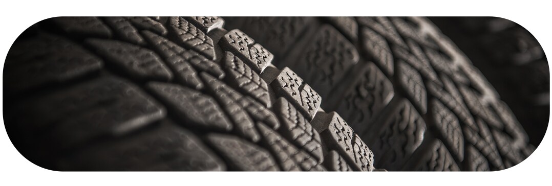 How to check your tires' health at Jack Giambalvo Hyundai | Close-up of tires lined up in dramatic lighting