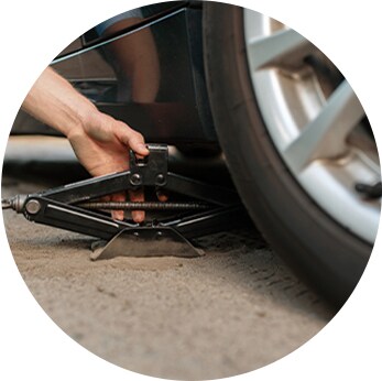 How to check your tires' health at Jack Giambalvo Hyundai | Close-up of car jack being used to lift the car