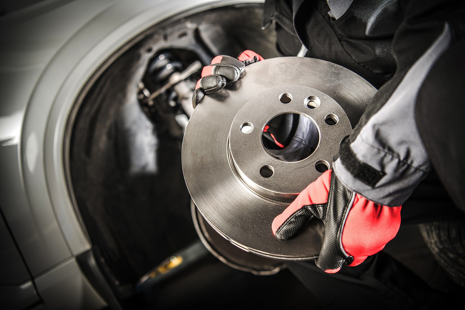 Brake replacement and Safety at Jack Giambalvo Hyundai of York | Mechanic carrying a brand new brake rotor