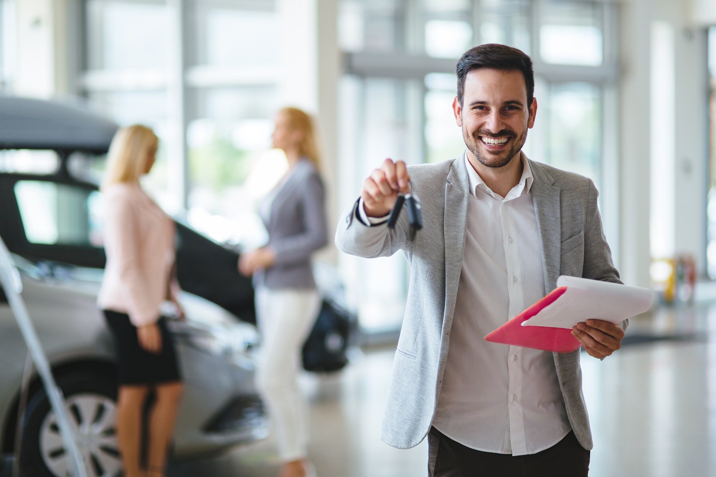 Jack Giambalvo Hyundai is a Hyundai Dealership in York near Lancaster, PA | Car salesman smiling and holding keys in showroom
