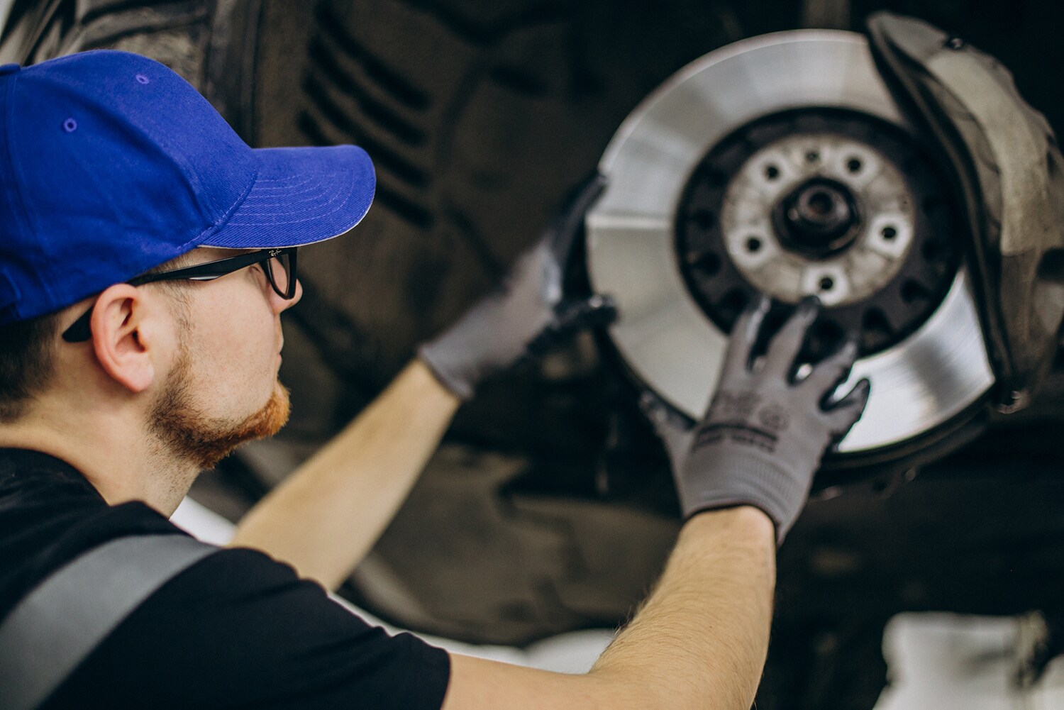 Brake replacement and Safety at Jack Giambalvo Hyundai of York | Service technician replacing brakes in a vehicle