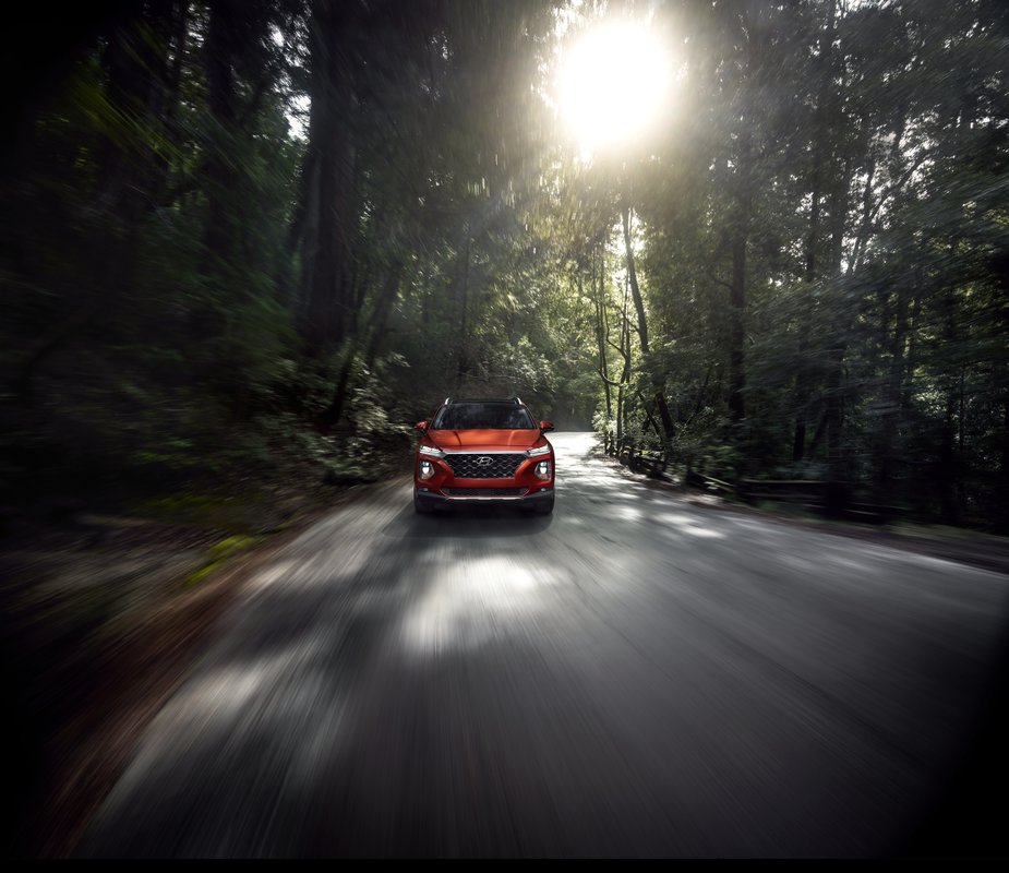 Jack Giambalvo Hyundai is a Hyundai Dealership in York near Hallam, PA | 2020 Hyundai Santa Fe driving through the woods