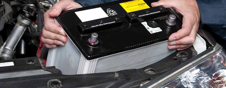 How to prepare your Hyundai for the winter season in York, PA at Jack Giambalvo Hyundai | Mechanic installing new car battery in car