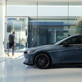 The 2021 Mazda3 vs. The 2021 Mazda6 at Jack Giambalvo Mazda | Mazda3 Hatchback parked in showcase