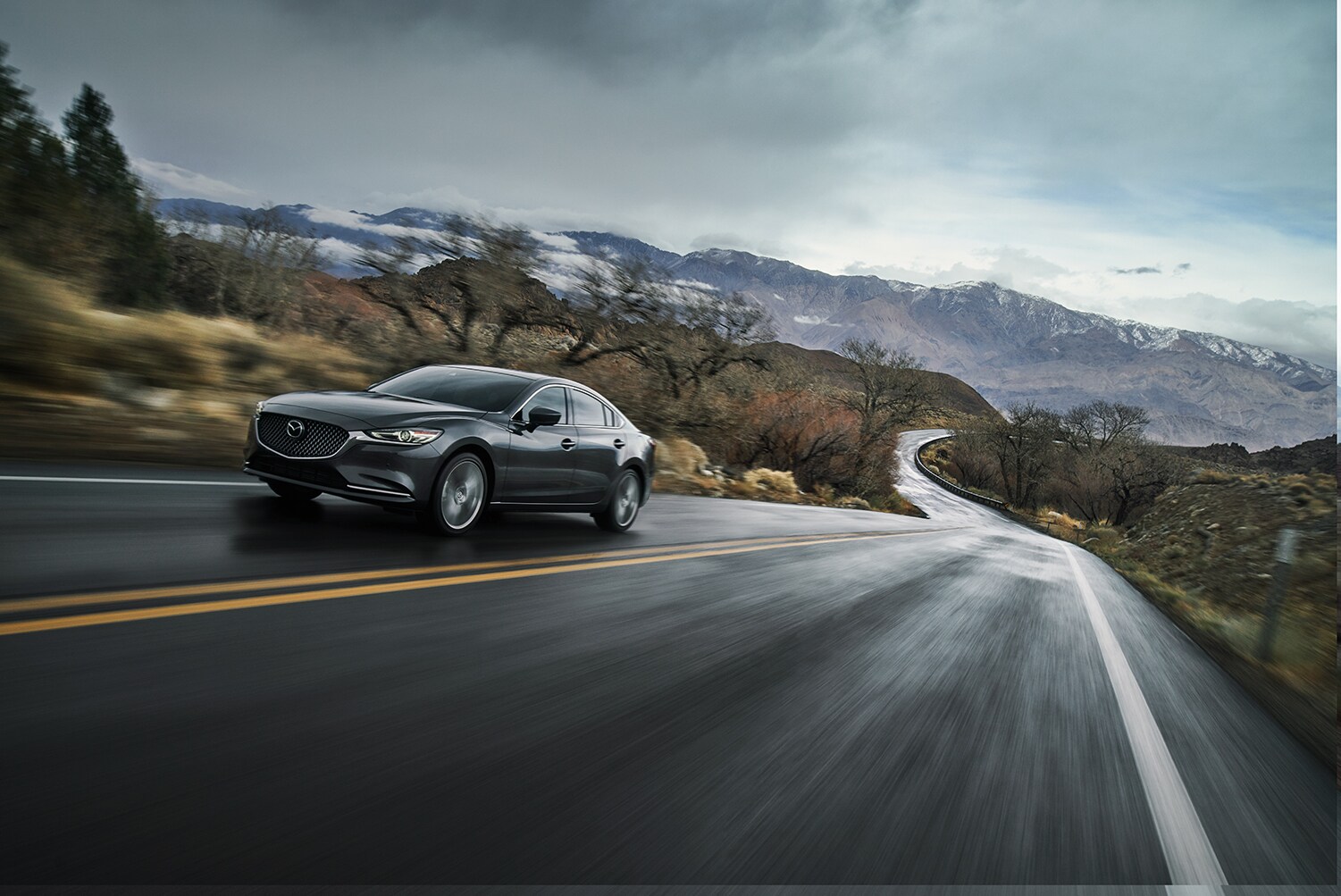 Jack Giambalvo Mazda is a Car Dealership in Valley View, PA | 2019 Mazda6 driving on a backroad