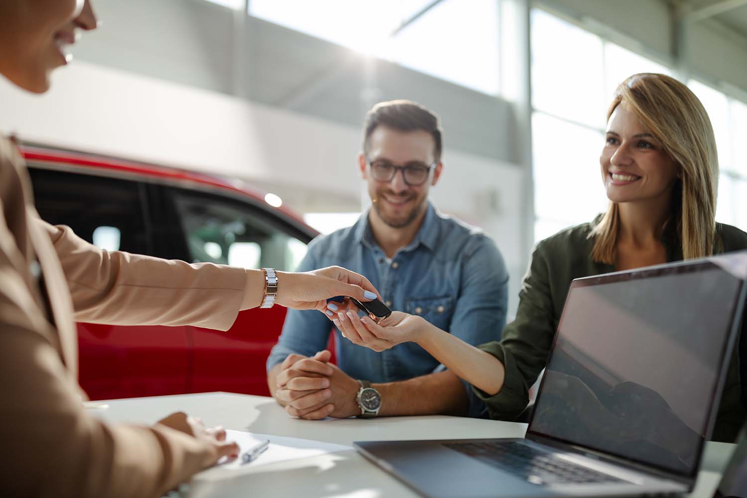 Things to Check When Buying a Used Car | Jack Giambalvo Mazda in York, PA | Couple buying a used car from female saleswoman