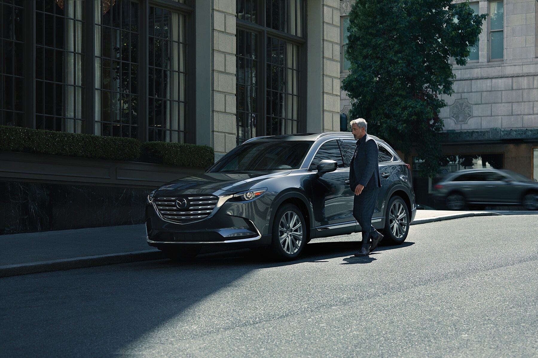 Can I trade in my leased vehicle at Jack Giambalvo Mazda in York | 2021 Mazda CX-9 parked outside of building