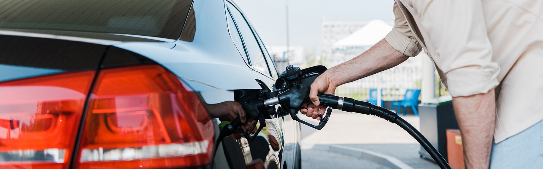 Best gas type for my vehicle at Jack Giambalvo Mazda | Man putting gas in vehicle at gas station