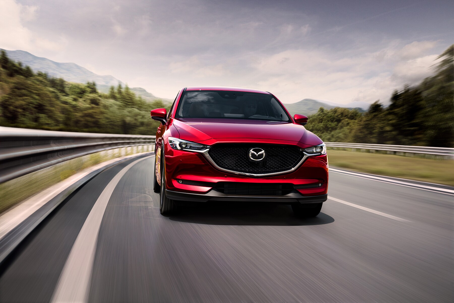 Can I trade in my leased vehicle at Jack Giambalvo Mazda in York | 2021 Mazda CX-5 driving down backroad