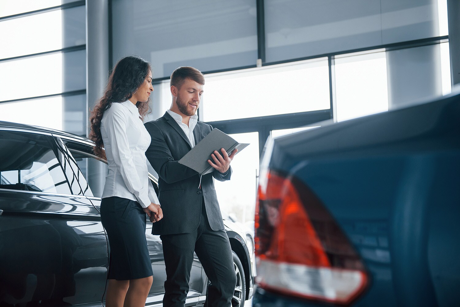 Defining GAP Insurance at Jack Giambalvo Mazda in York, PA | Salesman helping customer