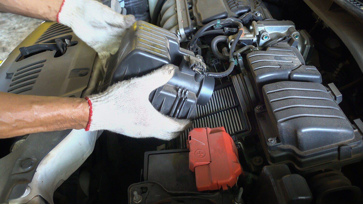 Cabin air filter replacement at Jack Giambalvo Mazda of York | Service technician replacing all air filters in a vehicle