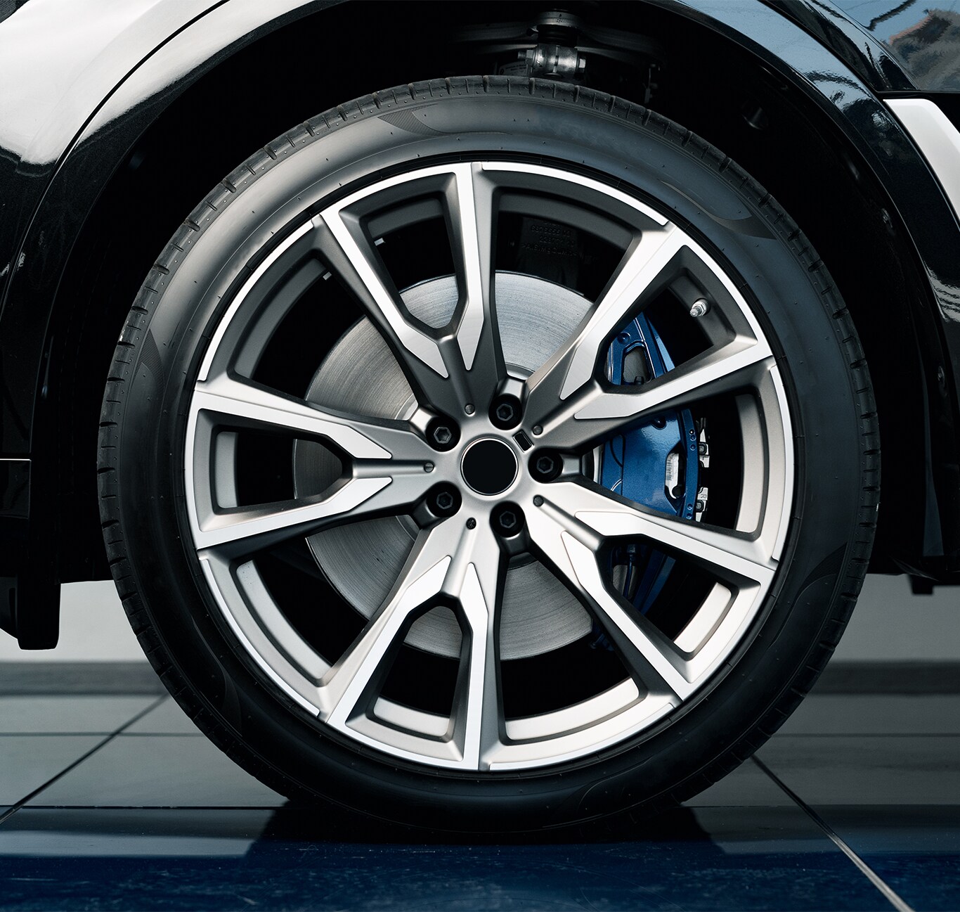 What is Tire and Rim Protection? | Jack Giambalvo Mazda | Detail look of car wheel with blue brake calipers