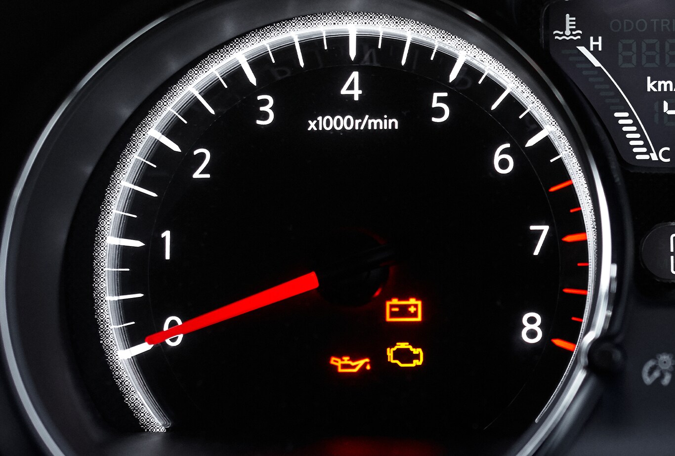 Understanding Your Mazda’s Emergency Lights at Jack Giambalvo Mazda in York, PA | Car dashboard with Red Battery light, Red Low Oil light, and Yellow Check Engine Light on