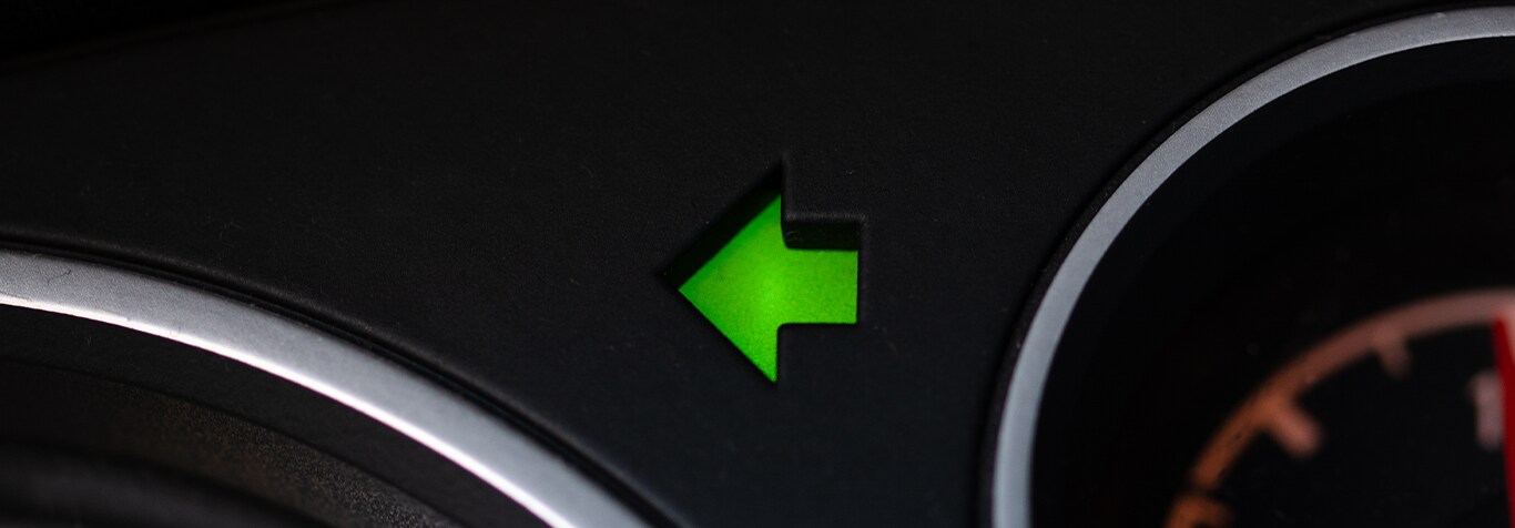 Understanding Your Mazda’s Emergency Lights at Jack Giambalvo Mazda in York, PA | Green Arrow turn signal located on car dashbaord