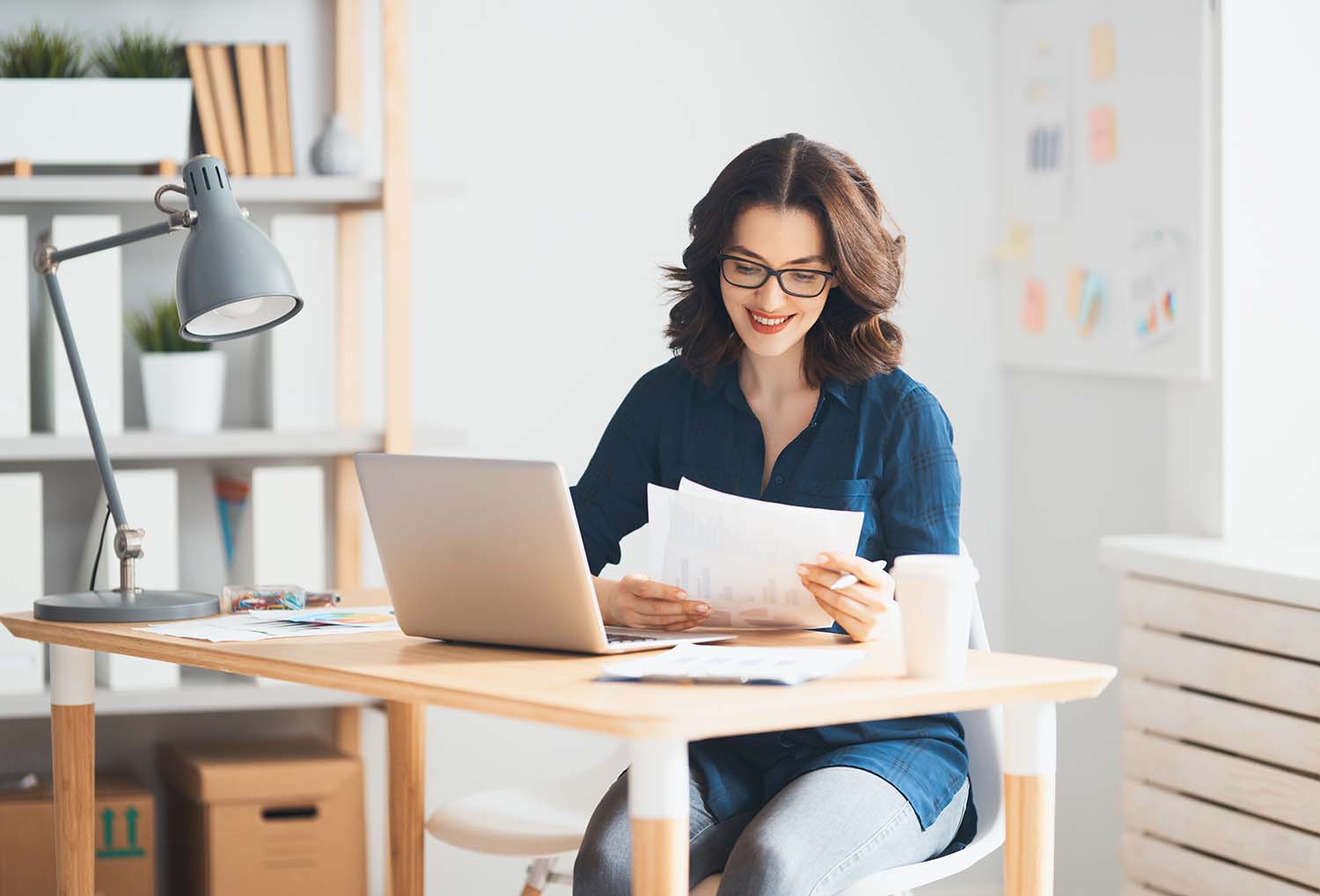 Things to Check When Buying a Used Car | Jack Giambalvo Mazda in York, PA | Woman viewing vehicle history report of a used car she might buy