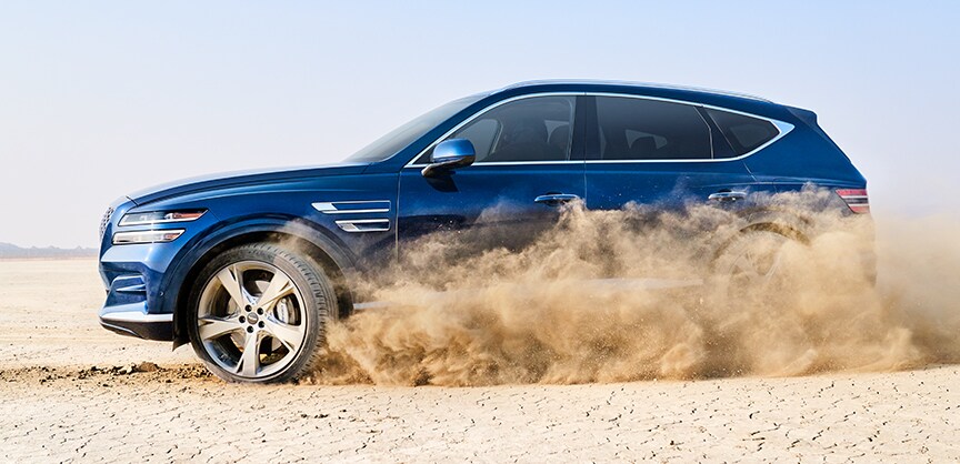 Genesis of York is a Car Dealership near Grantley PA | Blue GV80 SUV tearing up desert
