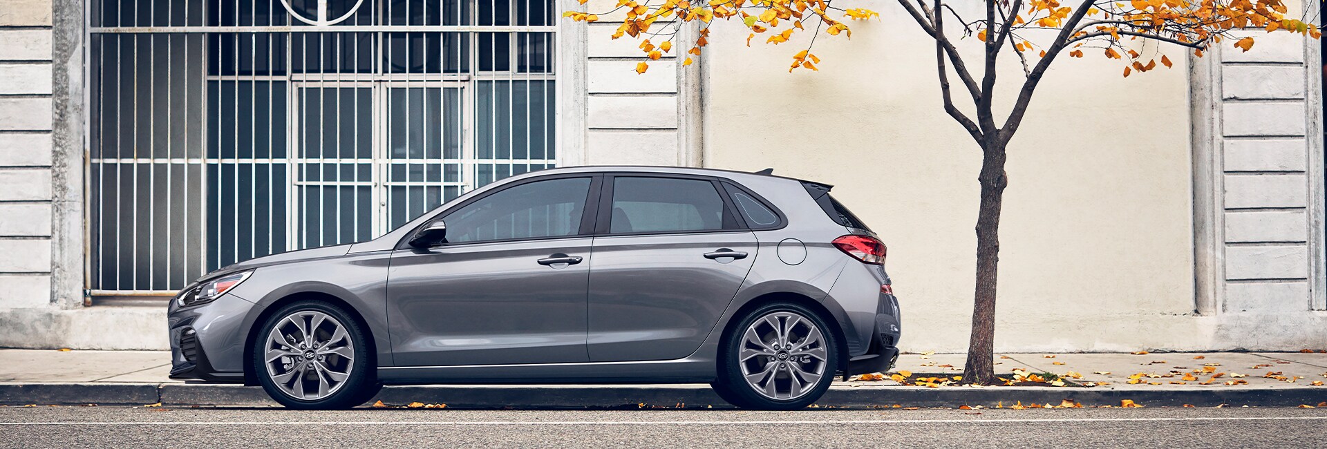 Jack Giambalvo Hyundai is a Hyundai Dealership in York near East York, PA | Elantra GT parked under city street tree