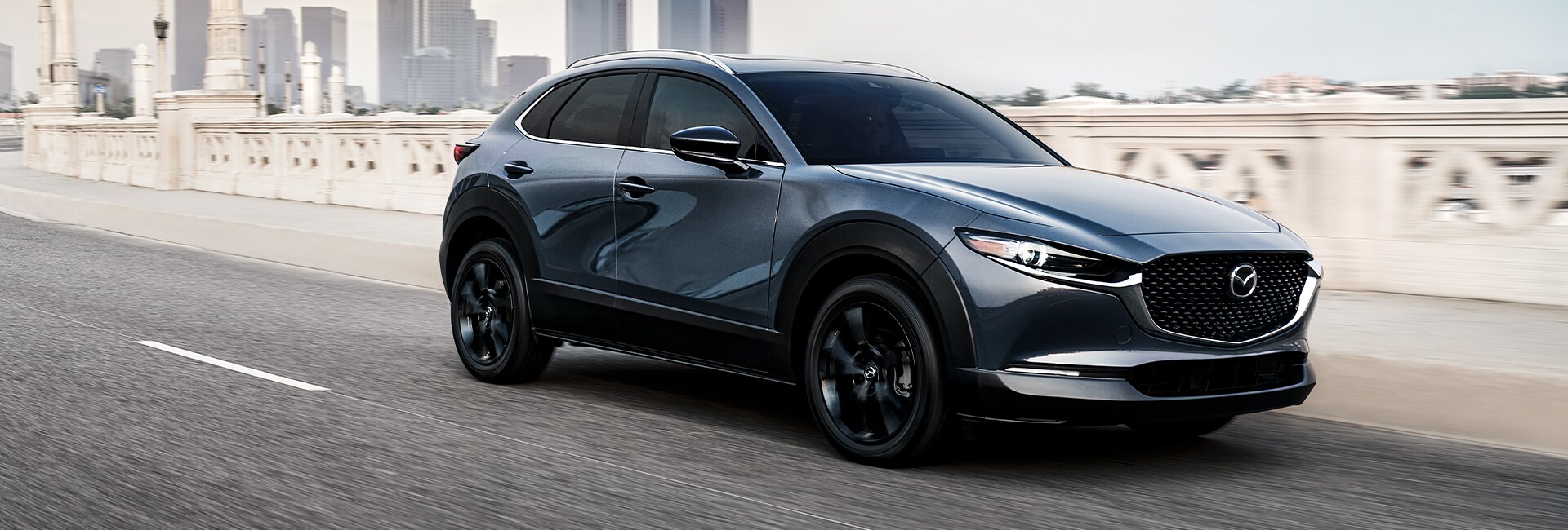 Jack Giambalvo Mazda is a Car Dealership in East York, PA | Mazda CX-30 Speeding down city street