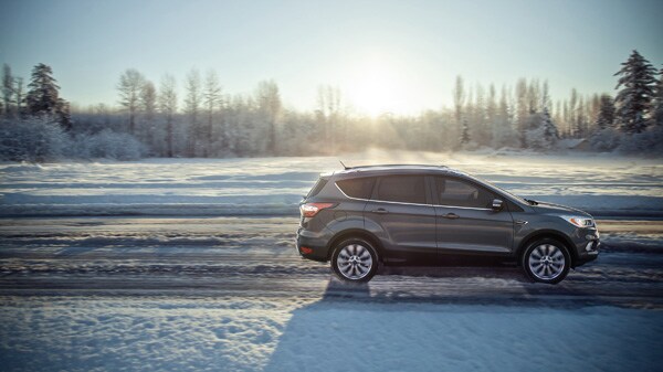 Ford Escape Driving On A Snowy Road