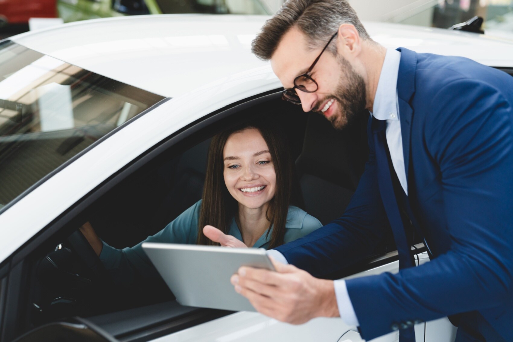 Acura Finance team member discussing financing options with customer