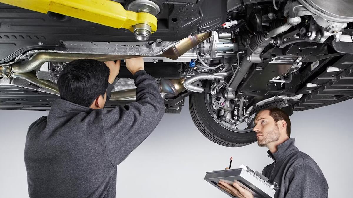 Jaguar service technicians working on a Jaguar vehicle