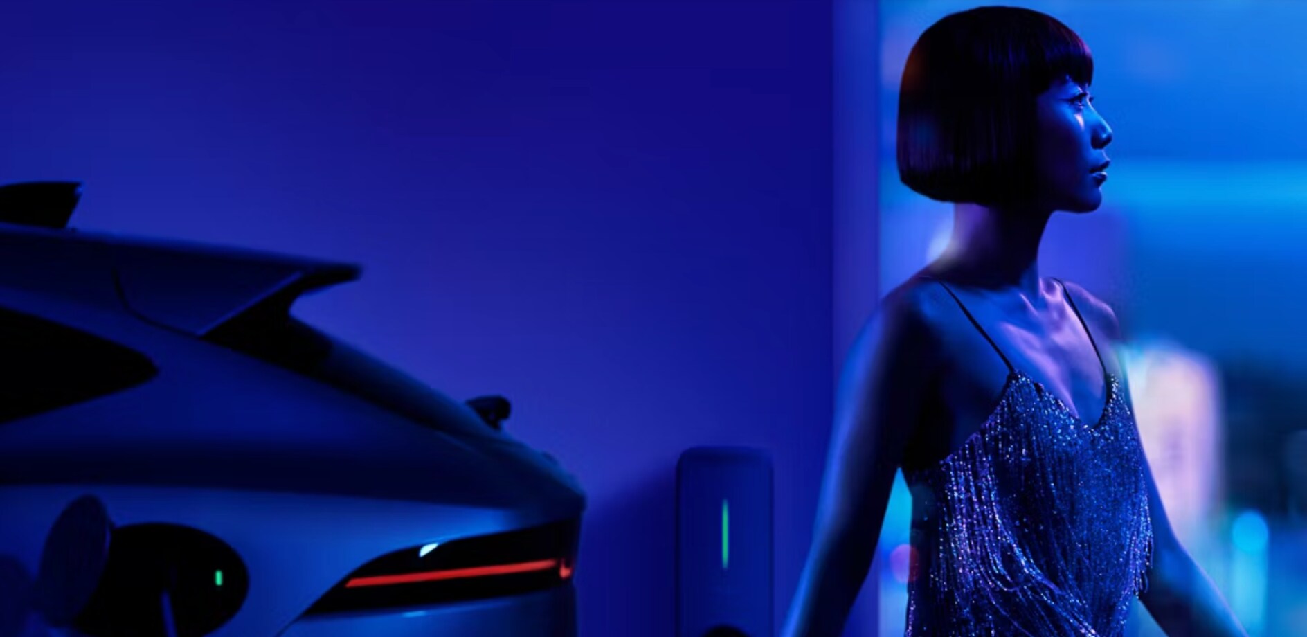 Woman charging an electric Jaguar Woman charging an electric Jaguar