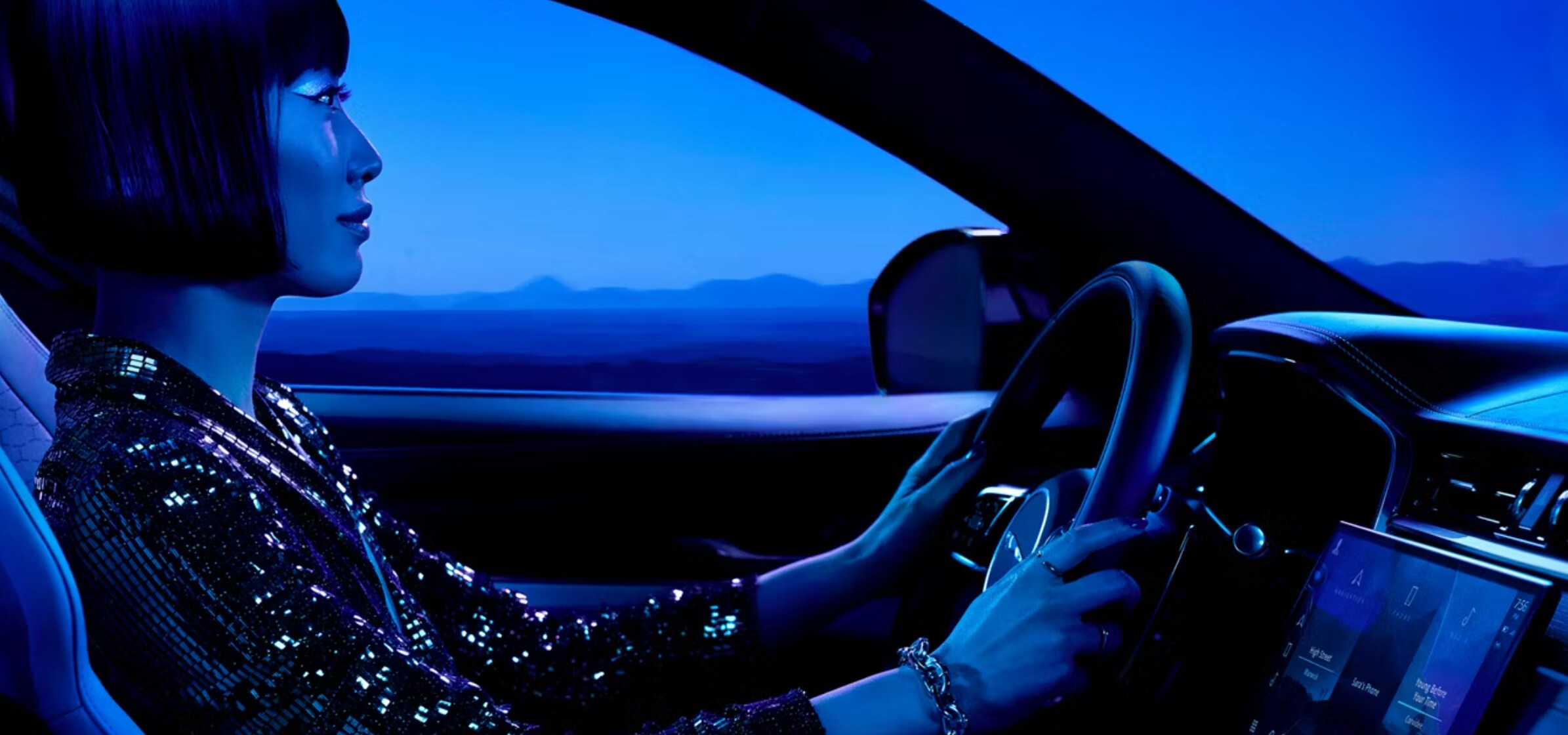 Person driving a Jaguar F-Pace (interior) Person driving a Jaguar F-Pace (interior)