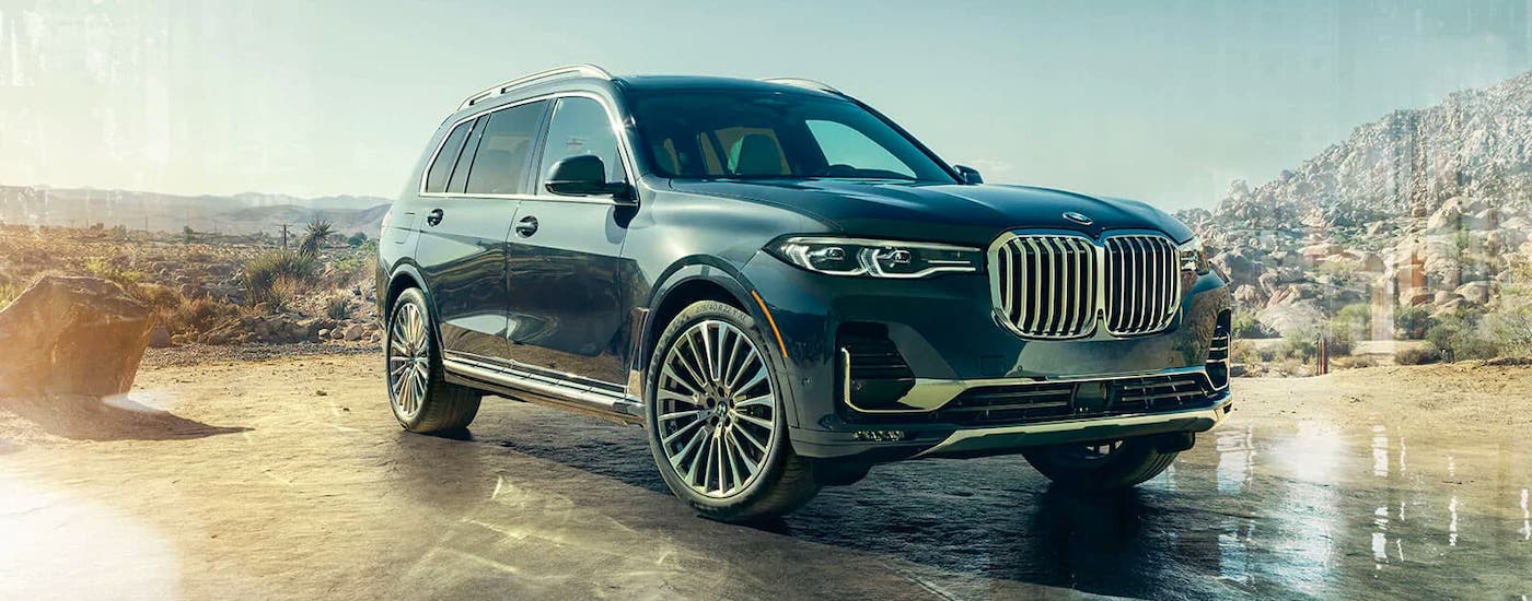 Cincinnati BMW Lease 2021 BMW X7.jpg A black 2021 BMW X7 is parked in front of a desert and mountains.