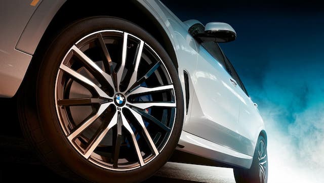A closeup is shown of the wheel on a white 2020 BMW X5 in Cincinnati, OH.