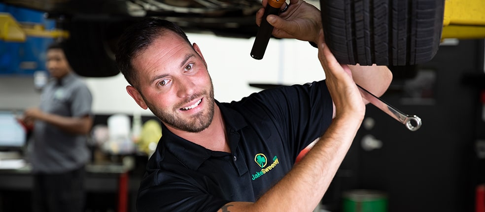 Professional mechanic working on a car engine
