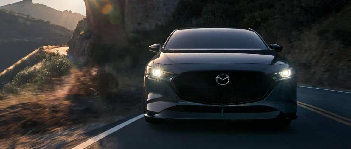 2026 Mazda3 Hatchback showing its performance capabilities on the road.