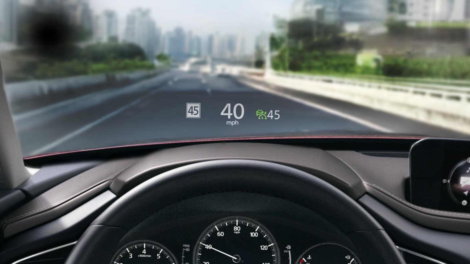 Red Mazda CX-30. High-tech head-up display. Visit Jake Sweeney Mazda Tri-County.