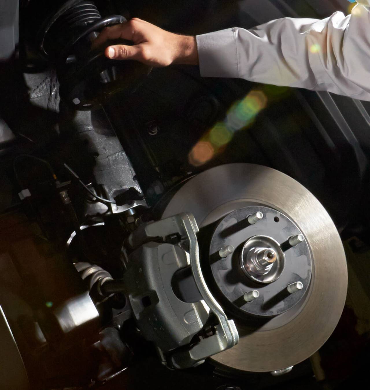 Professional mechanic working on a car engine