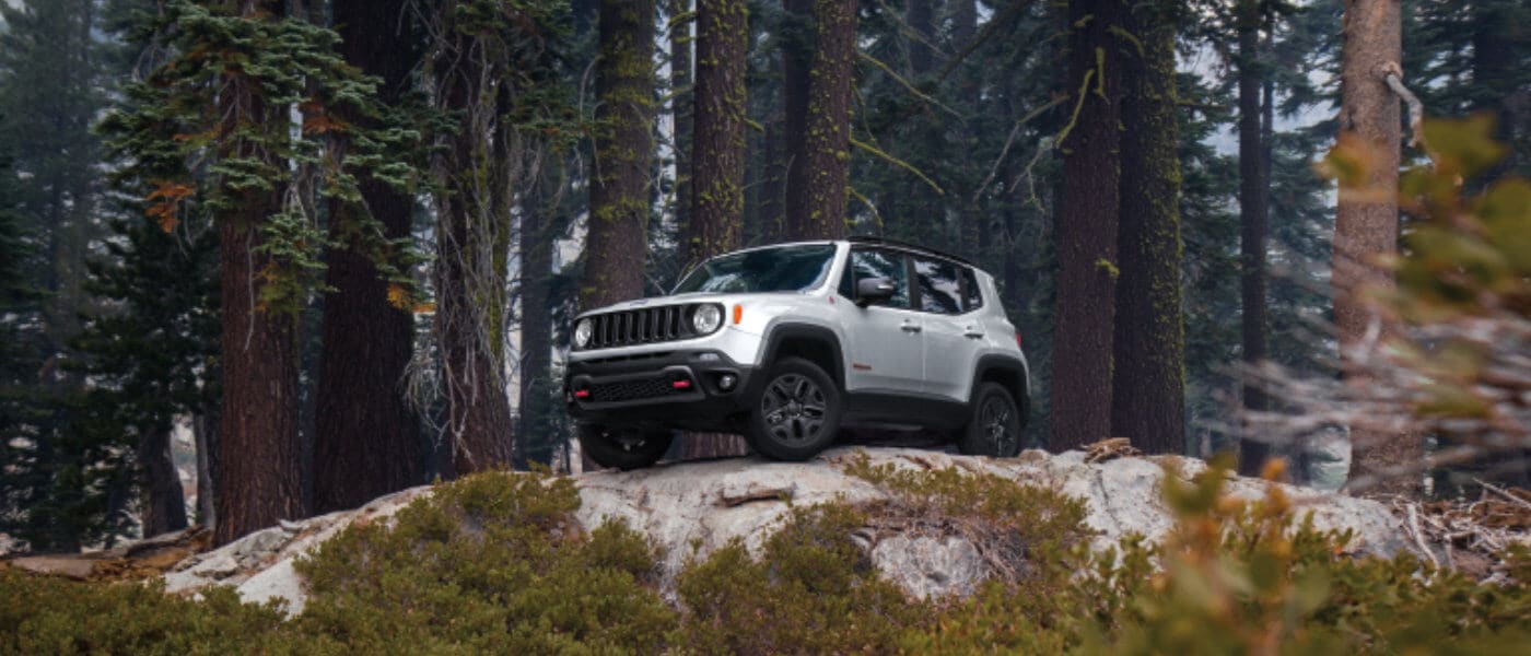 2020 Jeep Renegade driving on a boulder