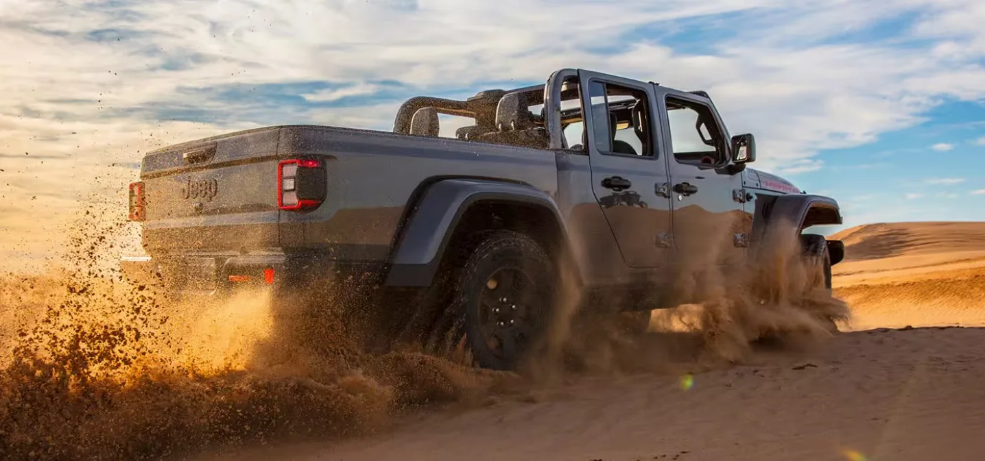 2026 Jeep Gladiator 2026 Jeep Gladiator kicking up sand in the desert