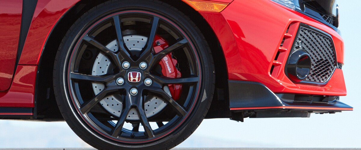 Wheel shot from a parked Honda car