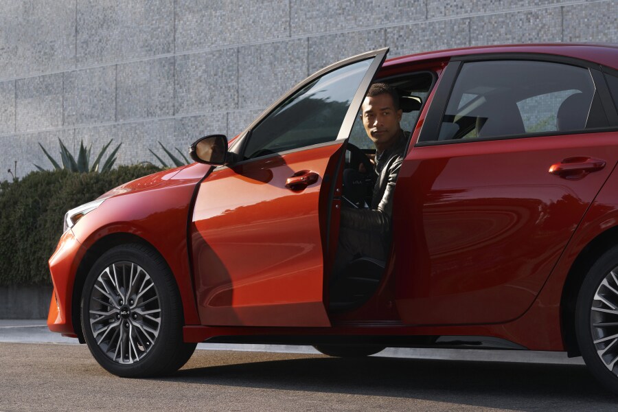 Man in red 2023 Kia Forte